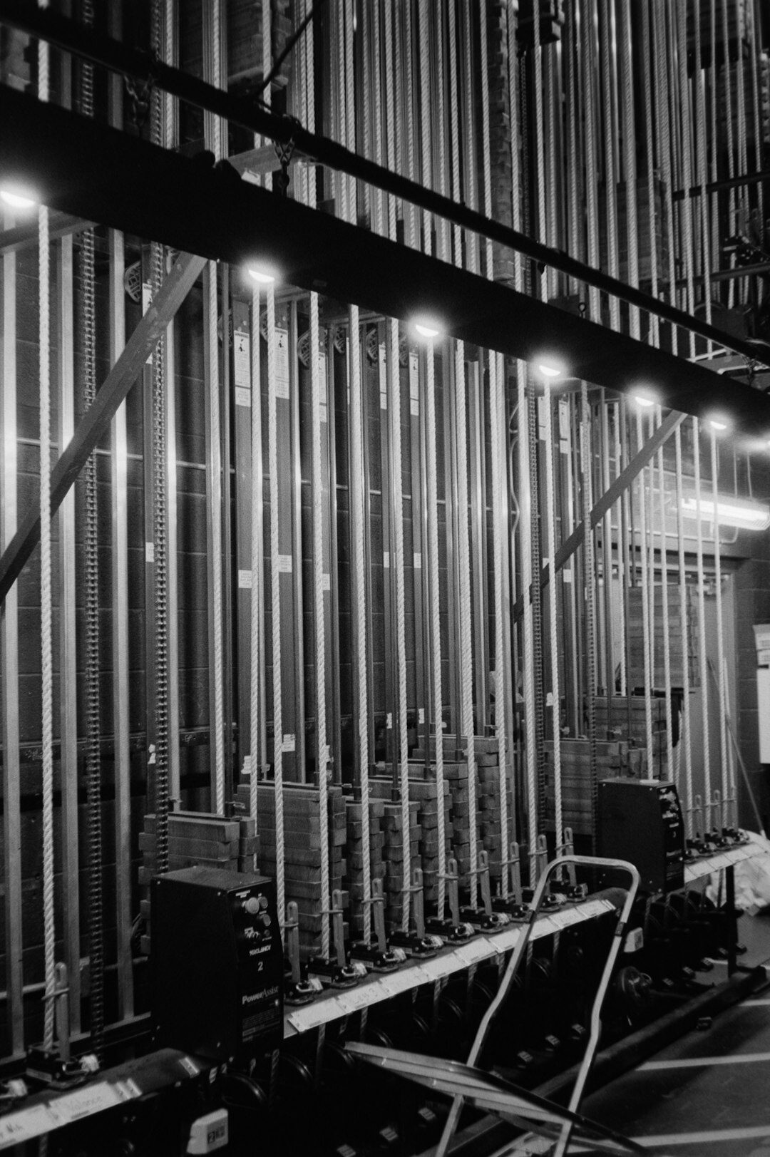 Empty television studio with multiple cameras and lighting rigs